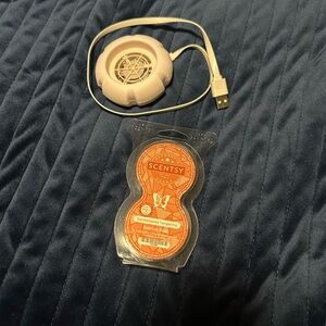 Mini fan diffuser, blush in color and a pack of pods